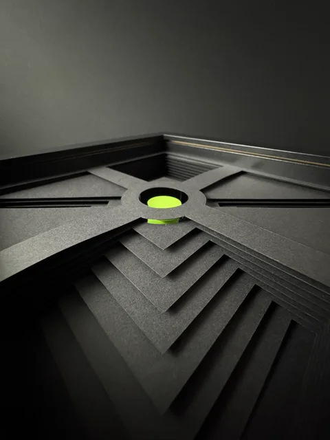 NF-01. Low view across the paper layers toward the lime circular center.