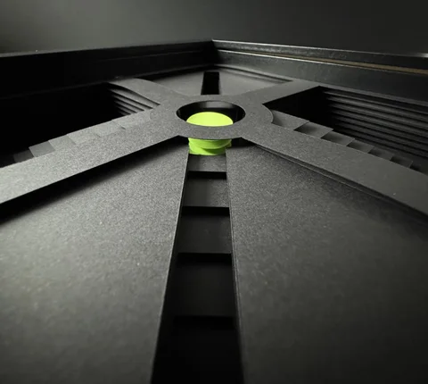 NF-01. Close-up of the raised circular opening and lime paper beneath it.