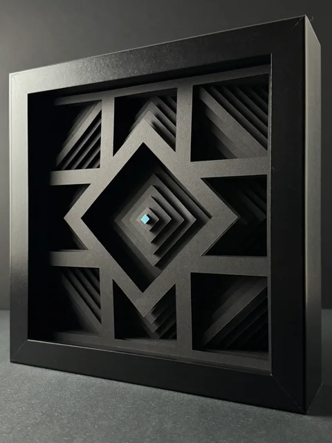 NF-02, layered paper diamonds with a cyan center.