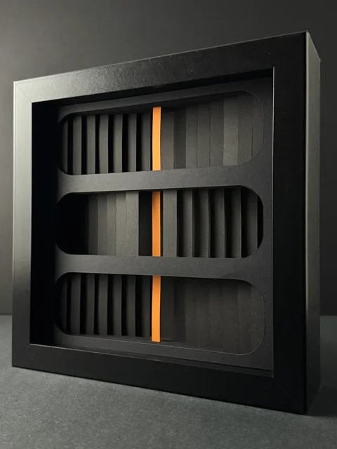 NF-03, rounded paper openings with an orange core.